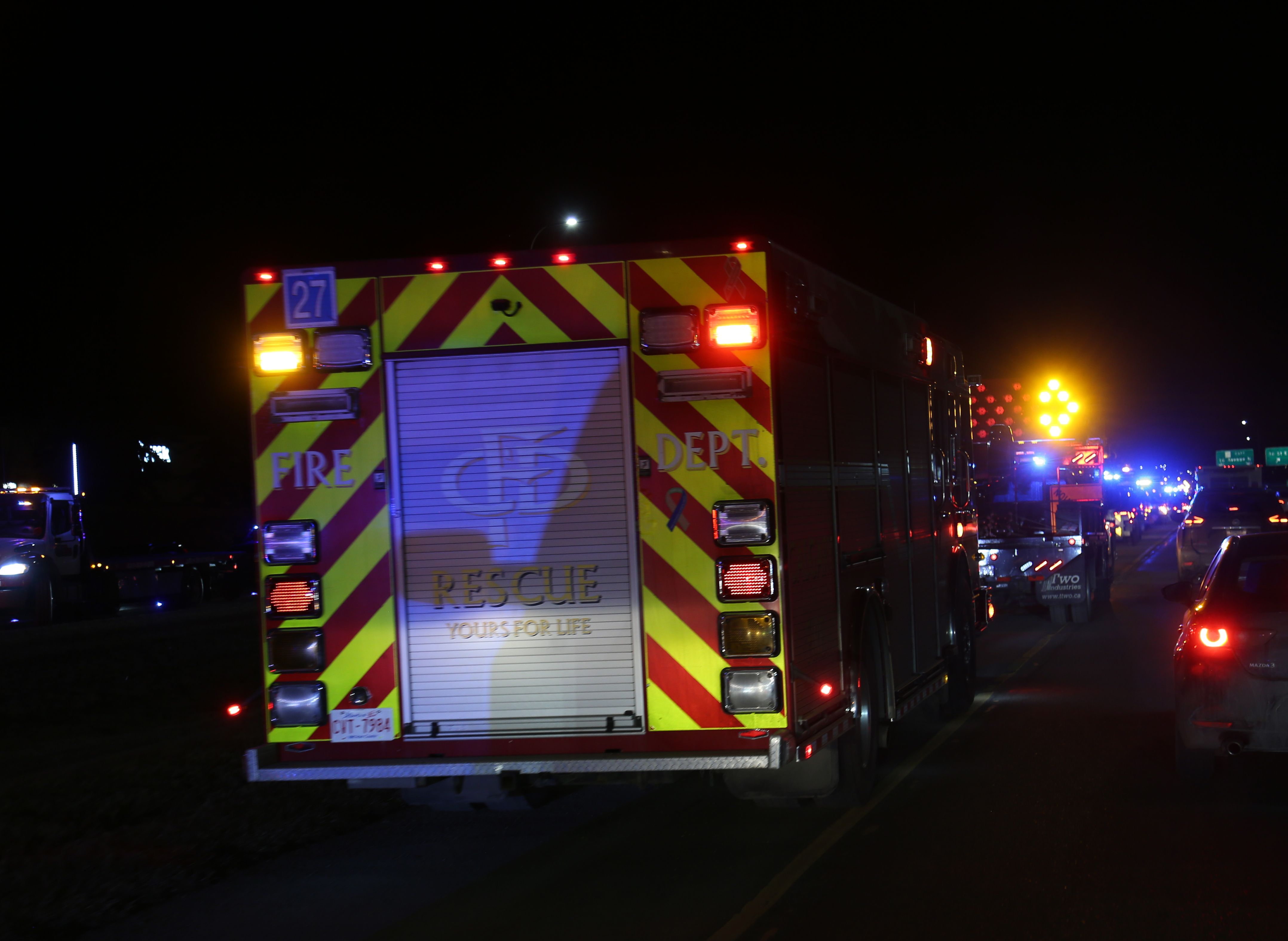 A Calgary Fire Department rescue truck is parked along 16 Avenue N.E. during the Slow Down Move Over roadside safety campaign in Calgary on March 5, 2026. Photo / Anna Ferensowicz / Discover Airdrie